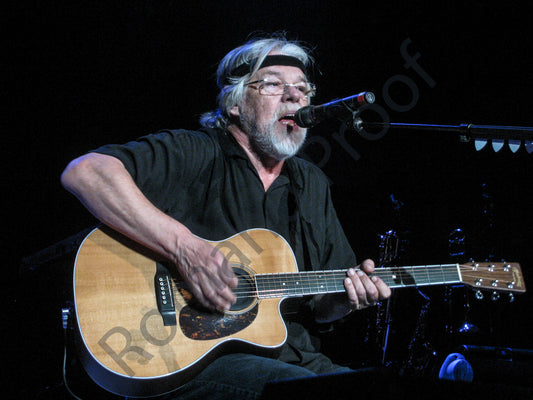 Bob Seger playing an Acoustic Guitar